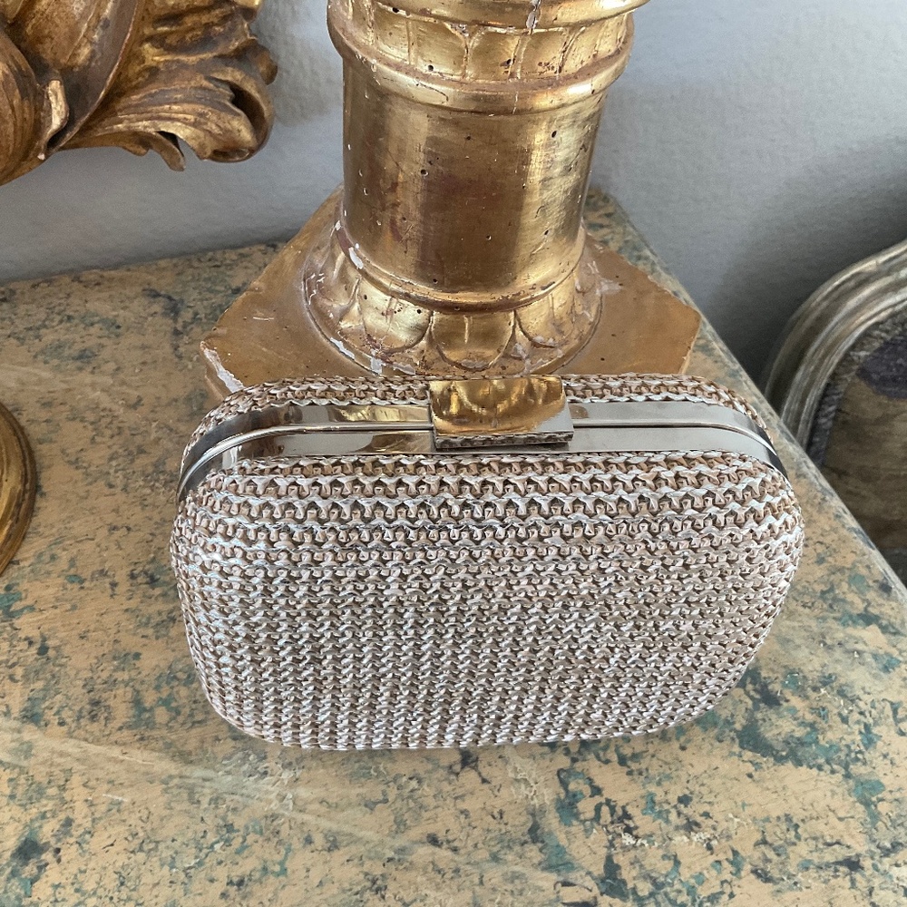 Expressions NYC textured clutch with metal accents